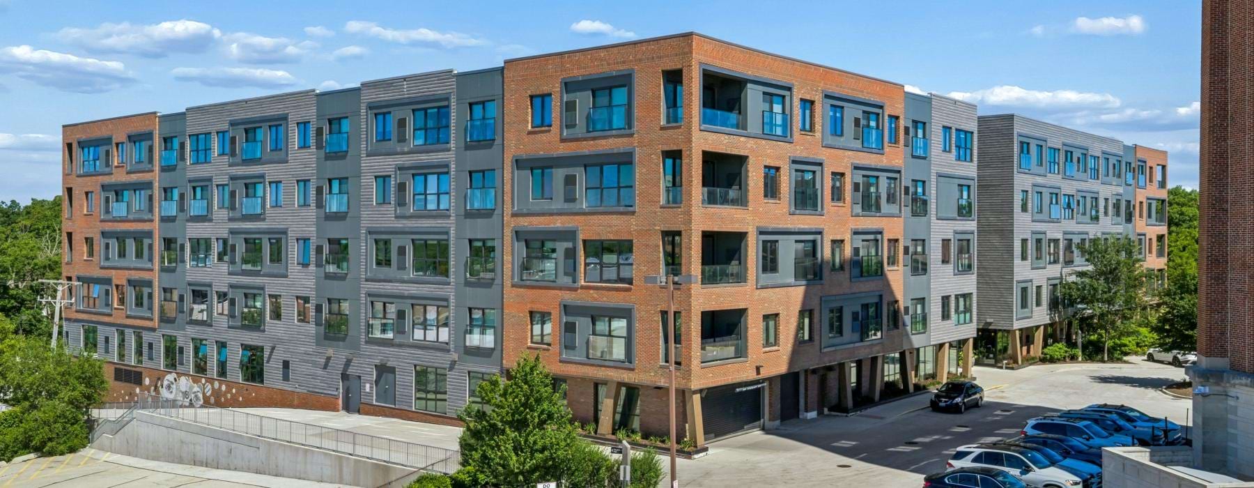 a building with cars parked in front