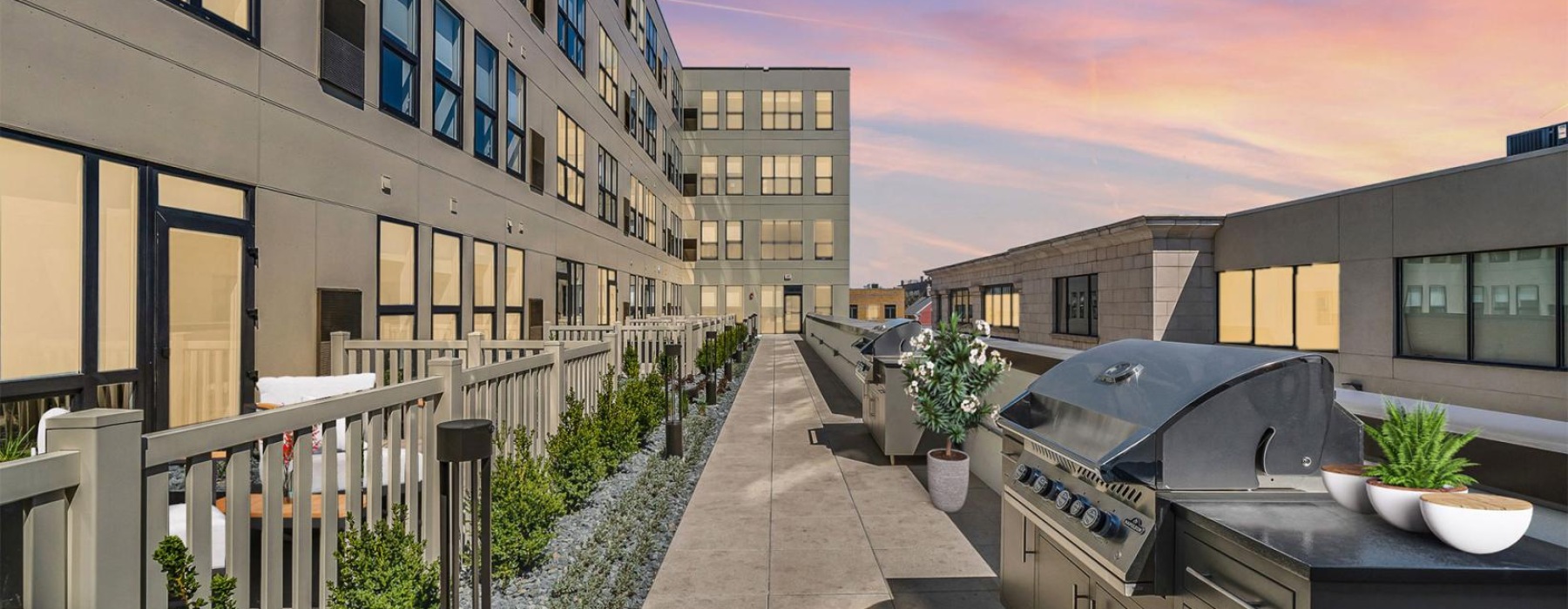 a courtyard with buildings and plants